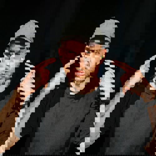 A commercial director looking at the camera